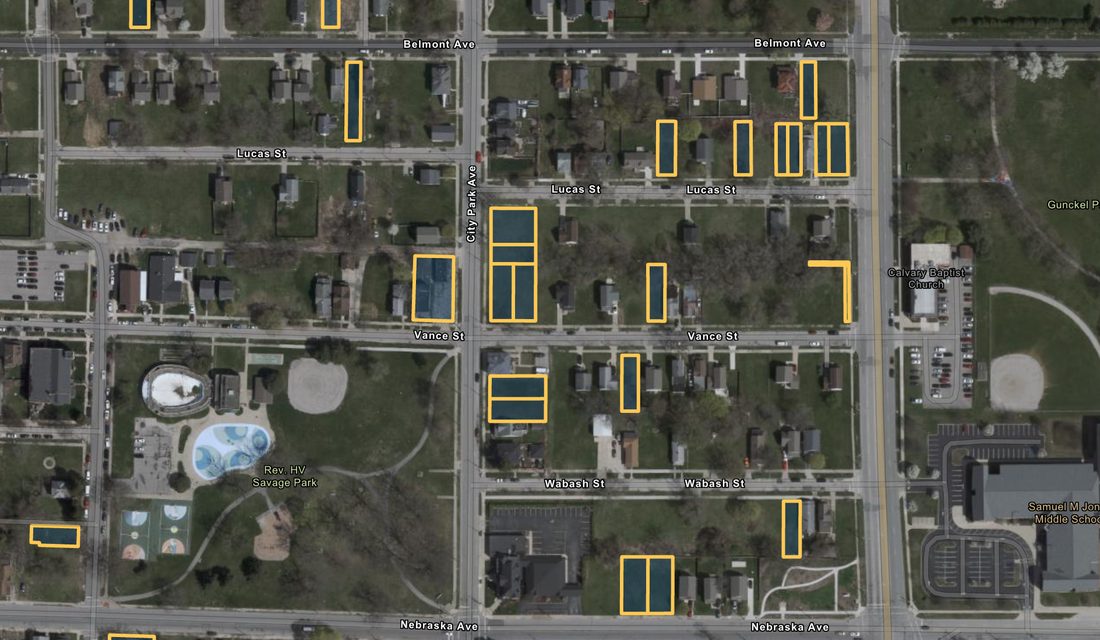Aerial view of the same blocks today, with publicly owned vacant parcels outlined in yellow along City Park Avenue, Lucas, Vance, Wabash and Nebraska.